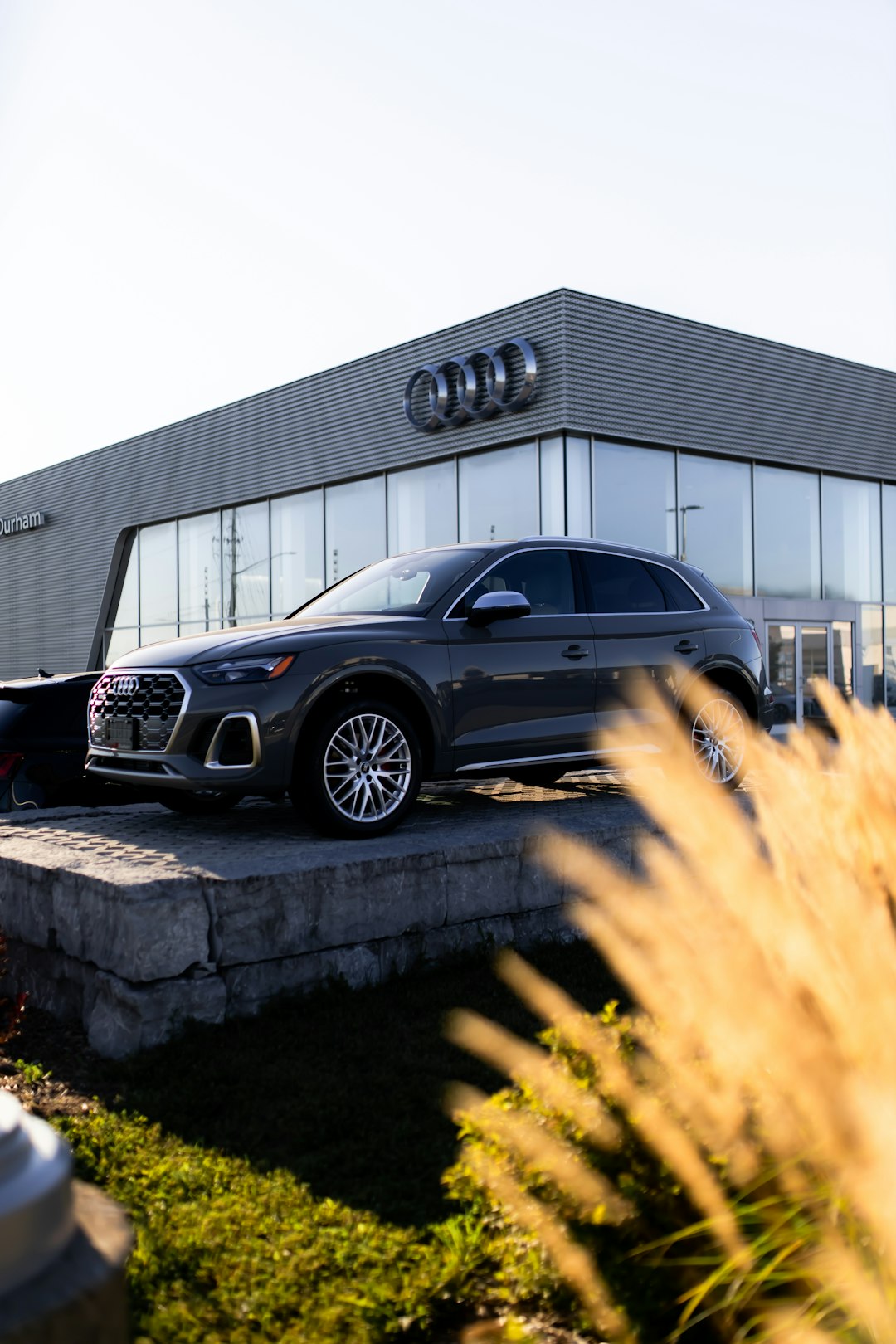 a-car-is-parked-in-front-of-a-building-b2-woi-n-y8